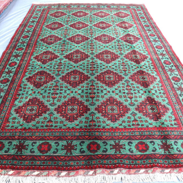 Green Bukhara rug 3.1m x 2m, hand-knotted, durable, traditional design, ideal for living rooms.