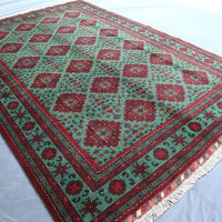 Green Bukhara rug 3.1m x 2m, hand-knotted, durable, traditional design, ideal for living rooms.