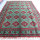 Green Bukhara rug 3.1m x 2m, hand-knotted, durable, traditional design, ideal for living rooms.