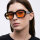 Meller Marli MR-TUTORANGE sunglasses, model no. 52/19/145, stylish in black and orange, UV protection, lightweight frame, trendy design, ideal for everyday life and leisure.