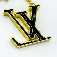 Louis Vuitton Fleur de Monogram, gold-tone key & bag charm, iconic floral design, elegant accessory